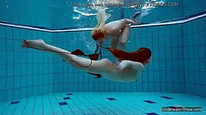 i'm one of two hot lesbians in the pool, underwater with blonde.