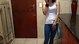 Amateur woman peeing in jeans while smoking and stripping
