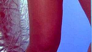 Suggestive-Neutral college desi with sexy dress and sneakers plays with glass dildo