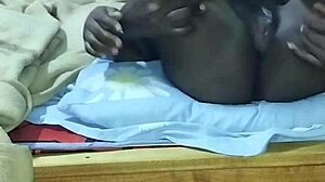 African mature black male licks hairy pussy in closeup cunilingus with wet fingering and sucking action.