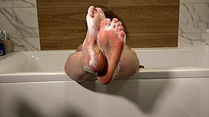 do you want to wash my feet? asks the mature milf in the bath with foot fetish vibes.