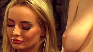 Busty lesbian slave with big natural boobs gets fingered by dominant madame.