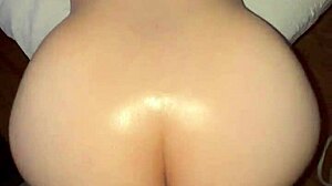 Oiled big ass Latina bends over for a close-up view. The brunette teen slut shows off her shaved pussy in this amateur scene.