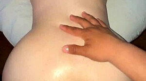 Oiled big ass Latina bends over for a close-up view. The brunette teen slut shows off her shaved pussy in this amateur scene.