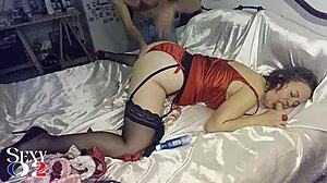White slut in red satin dress, black corset, red satin panties, stockings, and velvet high heels does blowjob, rimming, doggystyle, and sextoys.