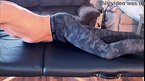 Stretching and compression pants session on massage table in high definition short version with muscular bodybuilder.