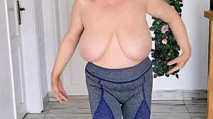 These giant mature boobs swing without a bra to the music in hot striptease