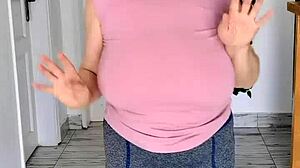 These giant mature boobs swing without a bra to the music in hot striptease