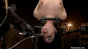 Bound and zippered slave contrasts pain with deep fingering in rough bondage session