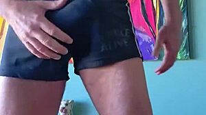 Pervy papifachero grabs his muscular cock in tight shorts. He cums hard with bodybuilder intensity.