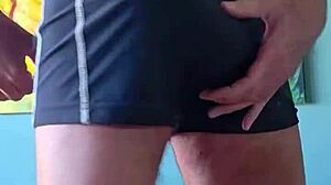 Pervy papifachero grabs his muscular cock in tight shorts. He cums hard with bodybuilder intensity.