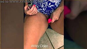 Wife inserts lush toy into shaved pussy on outdoor balcony