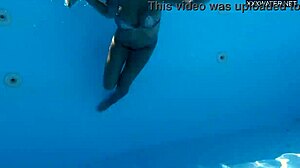 Hey there, beautiful big breasted Angelica Heart in bikini by the pool with her friend.