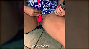 Wife inserts lush toy into shaved pussy on outdoor balcony