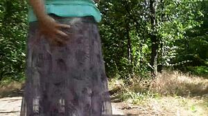 Do you like watching a hairy mature woman flash her pussy in this transparent dress outdoors?
