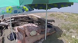 hey, can you believe this stepdaughter is jerking her stepdad's cock right on a tenerife nudist beach without any shame? 😲🍆