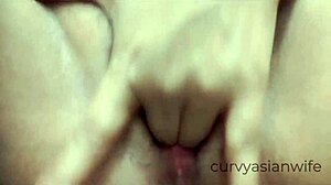 Thai slut shows Asian pussy in close up while pissing