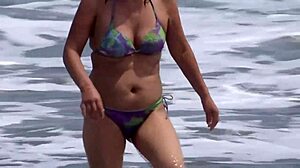 My wife takes out her tits and shows off her hairy pussy on a public beach