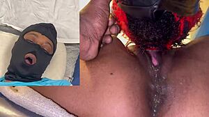 Oh, watch this ebony beauty squirt all over my dildo with her wet masked orgasm.