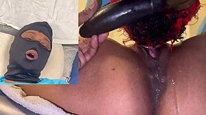 Oh, watch this ebony beauty squirt all over my dildo with her wet masked orgasm.