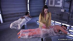 Bound slaves in anal foot fetish threesome get fisted and rimmed with strapon lezdom action