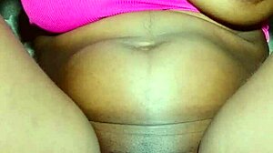 An African beauty with small tits poses elegantly in a serene setting. She showcases her natural grace and charm.