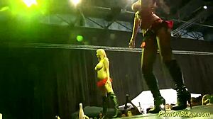 sharing cocks on stage at public sex fair 😈🔥