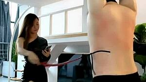 chinese mistress yihuan whips in boots wanna see?