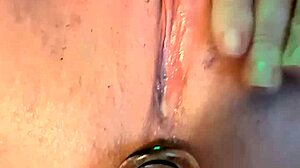 She slides in her first butt plug with excitement