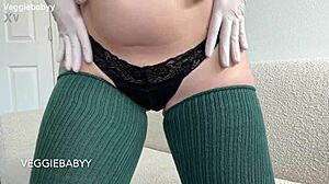 gloved redhead in thigh highs tempts you to jerk off with her dirty joi talk