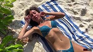 Pissing on shocked girl at public beach turns wild