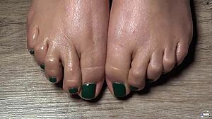 close up green nailed toes for your foot fetish massage