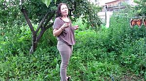 mature milf soaks jeans with golden shower piss in public garden outdoors