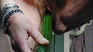 granny fucks her own hairy german pussy hard with thick cucumber