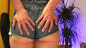 damn, her fat ass pokes out those tight denim shorts