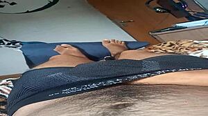 Young Brazilian stud jerks monster cock in bed solo