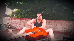 SEXY MUSCULAR guy strokes MONSTER COCK outdoors guitar-style