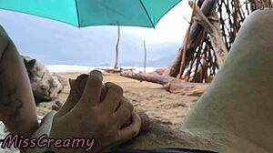 Stormy beach handjob leads to public cock cumshot orgasm