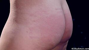 pierced brunette slave locked in device bondage torment