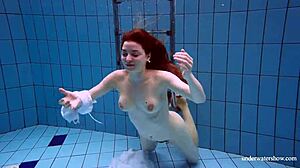 Redhead Marketa Slips White Dress into Pool Alluringly